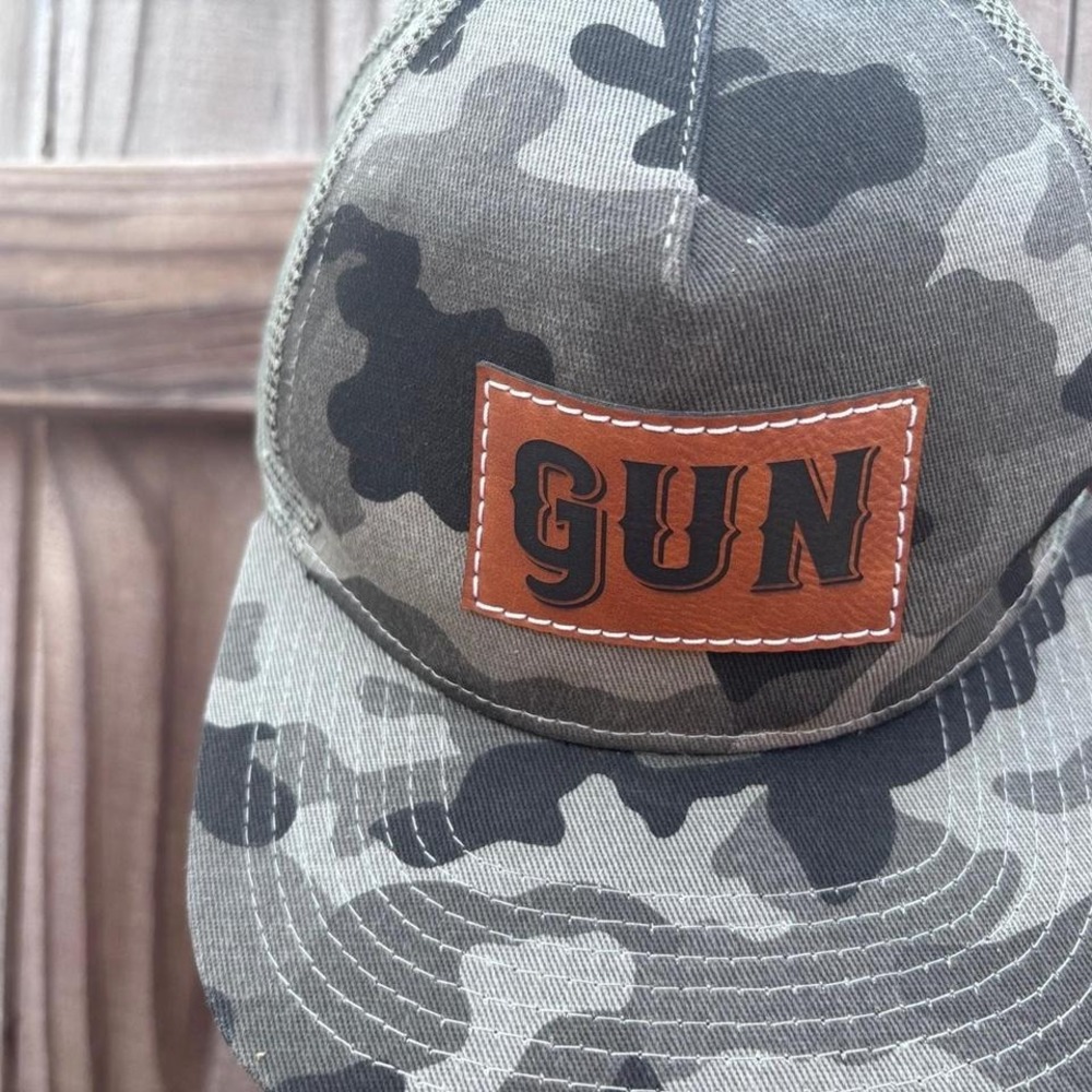This camouflage trucker hat is the Gun Snapback Hat by Fox + Fawn OS Adjustable